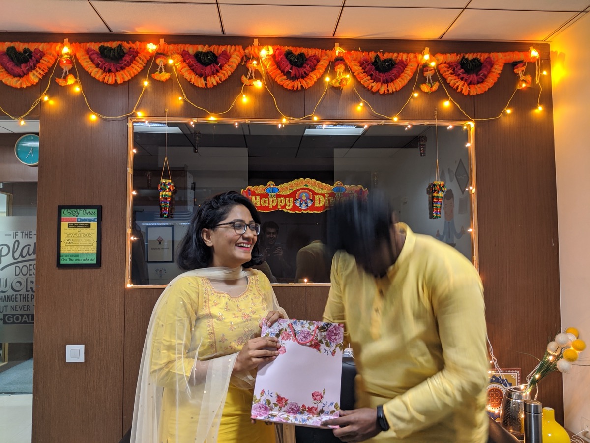 The team celebrating Diwali in a decorated office.