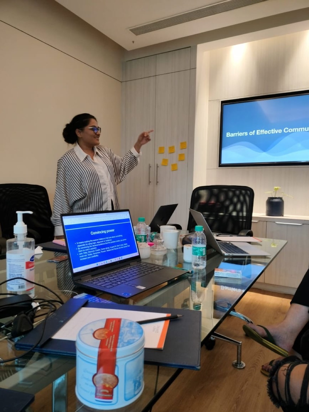 Cyphertree's founder leading a communication session at the annual team meet in Bengaluru, with a tin of Dutch stroopwafels on the table.